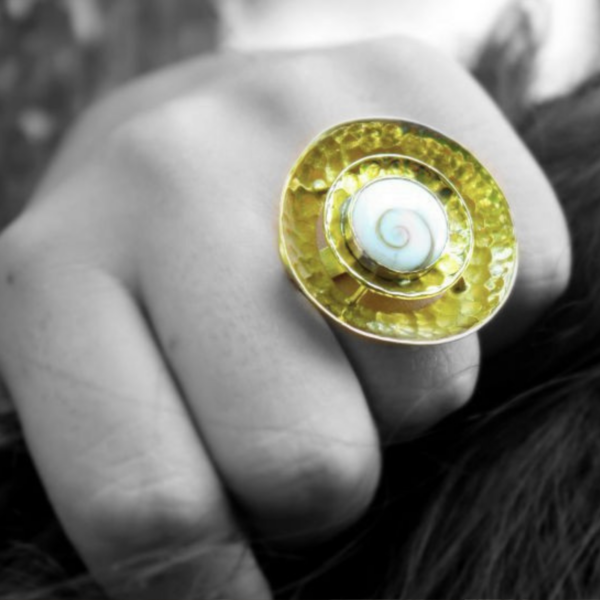 Handcrafted Shiva eye shell ring in a tribal brass spiral by CocoRoots