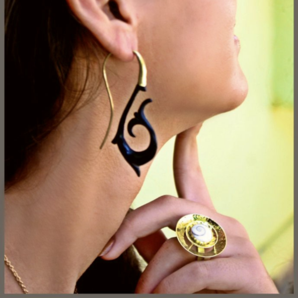 Handcrafted Shiva eye shell ring in a tribal brass spiral by CocoRoots