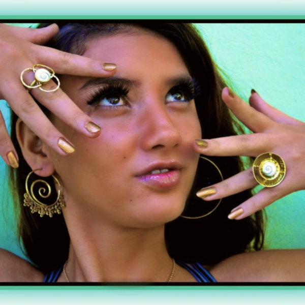 Handcrafted Shiva eye shell ring in a tribal brass spiral by CocoRoots