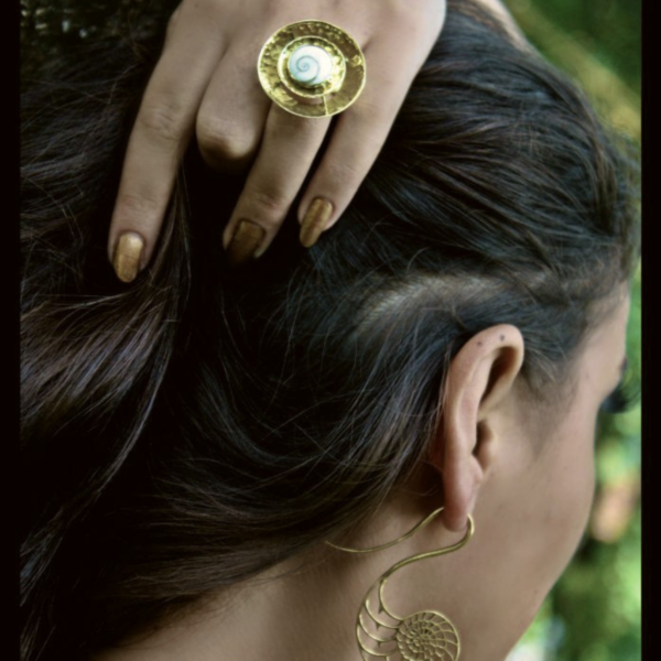 Handcrafted Shiva eye shell ring in a tribal brass spiral by CocoRoots